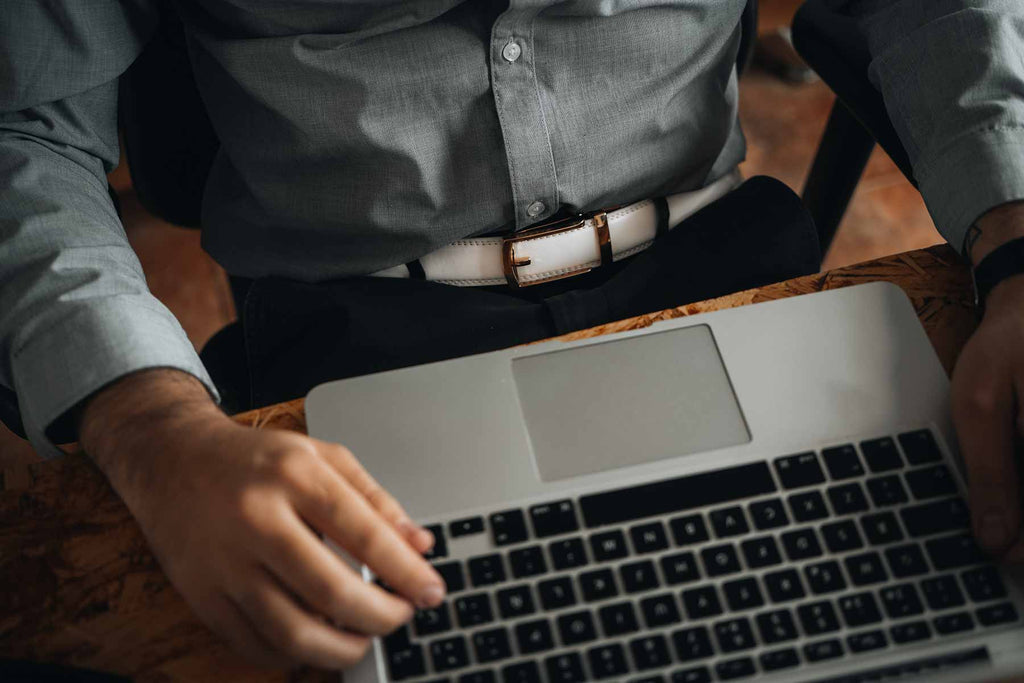 men with white belt on suit pants